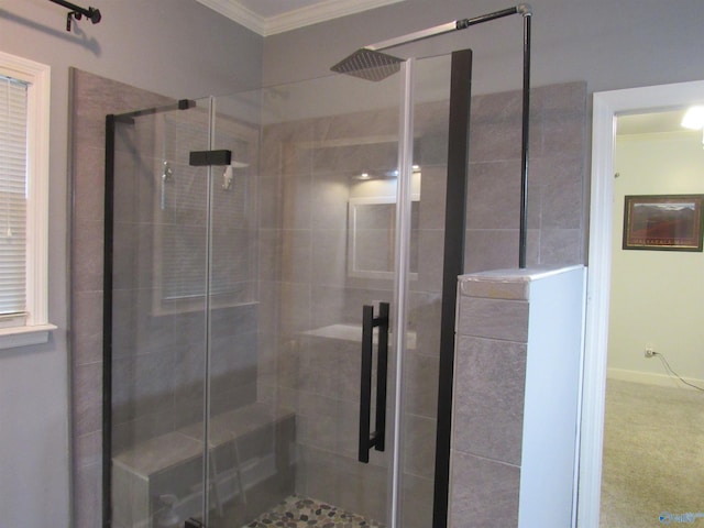 bathroom with ornamental molding and a shower with door