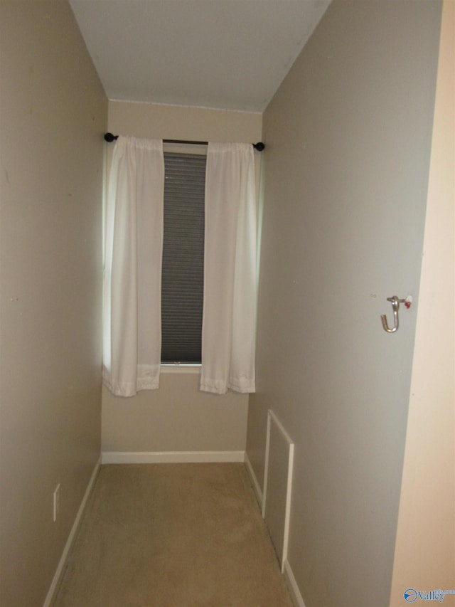 unfurnished room with light colored carpet