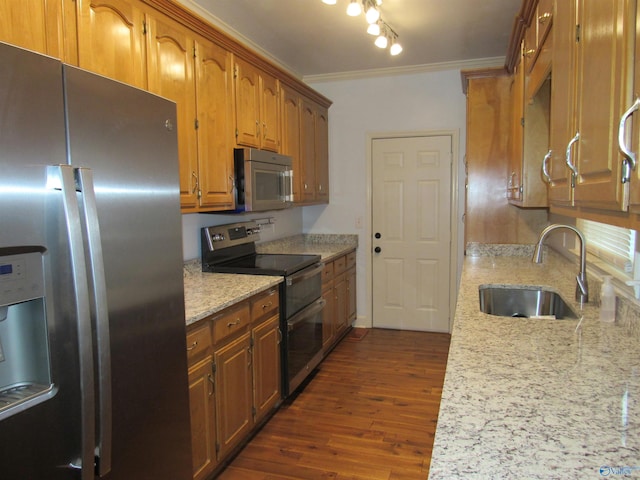 kitchen with sink, dark hardwood / wood-style flooring, stainless steel appliances, crown molding, and light stone countertops