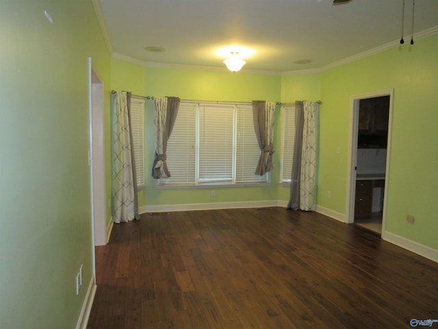 interior space with ornamental molding and dark hardwood / wood-style flooring