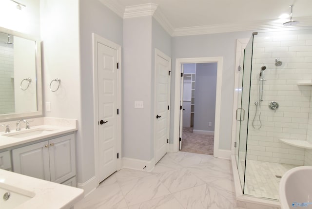 bathroom featuring ornamental molding, vanity, and a shower with shower door