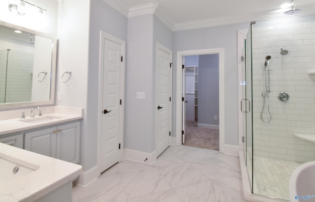 bathroom featuring vanity, a shower with shower door, and crown molding