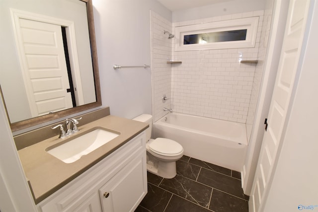 full bathroom featuring vanity, toilet, and tiled shower / bath