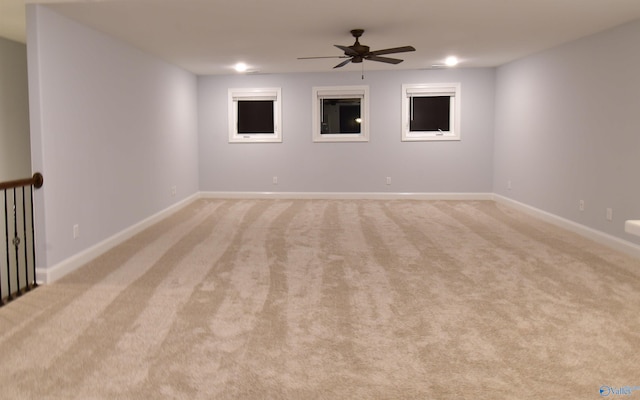 carpeted empty room with ceiling fan