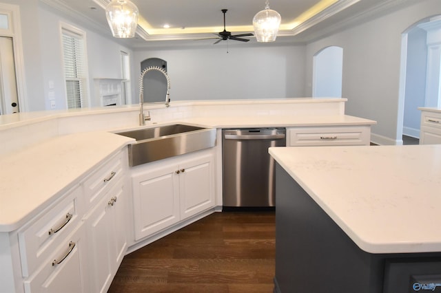 kitchen with dishwasher, dark hardwood / wood-style floors, sink, white cabinetry, and hanging light fixtures