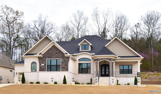 view of front of property with a front lawn and covered porch