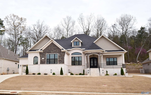 view of front facade with a front lawn and covered porch