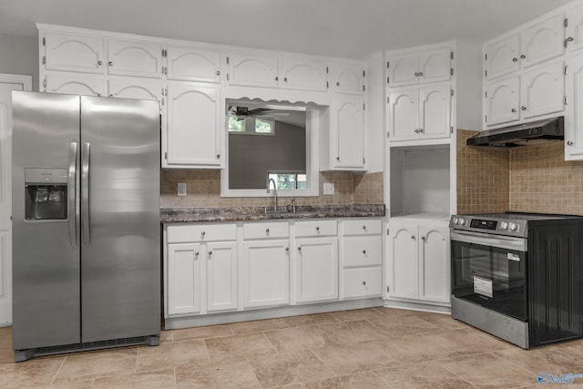 2703 Oakdale Ter, Huntsville, AL 35810 - kitchen with stainless steel appliances, under cabinet range hood, white cabinets, backsplash, and a ceiling fan