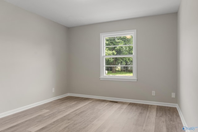 2703 Oakdale Ter, Huntsville, AL 35810 - empty room with light wood-style floors and baseboards