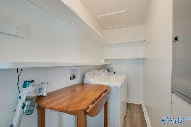 washroom featuring separate washer and dryer and hardwood / wood-style floors