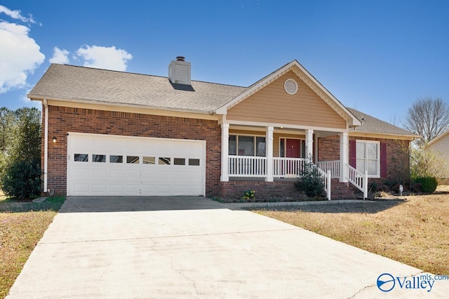 view of front facade with driveway, covered porch, an attached garage, brick siding, and a chimney