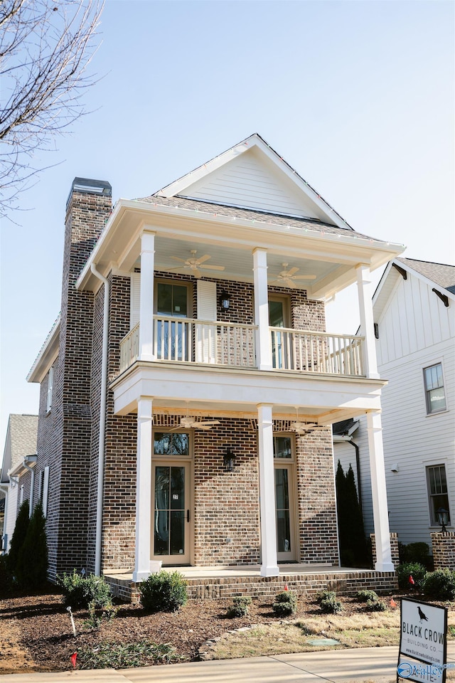 27 Lendon Main St, Huntsville, AL 35802 - neoclassical home featuring a porch, a chimney, brick siding, and a balcony