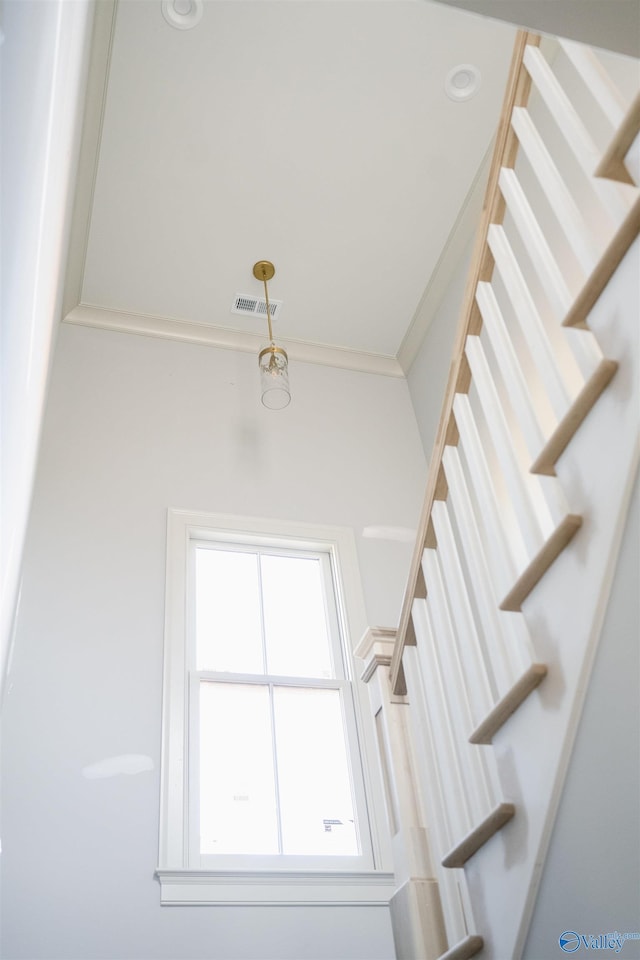 staircase with ornamental molding