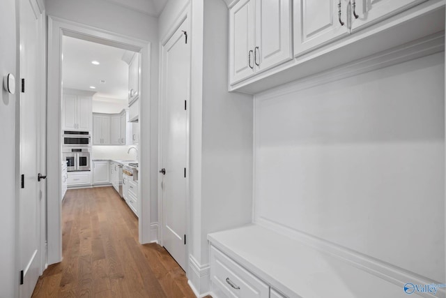 mudroom with hardwood / wood-style floors