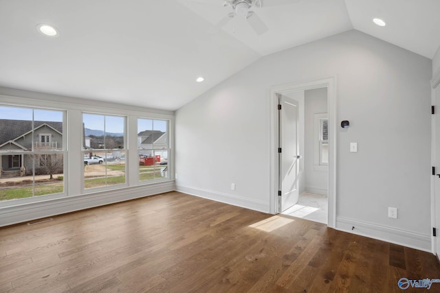 interior space with ceiling fan, light hardwood / wood-style floors, and vaulted ceiling