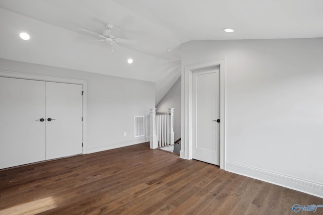 bonus room featuring ceiling fan, dark hardwood / wood-style flooring, and vaulted ceiling