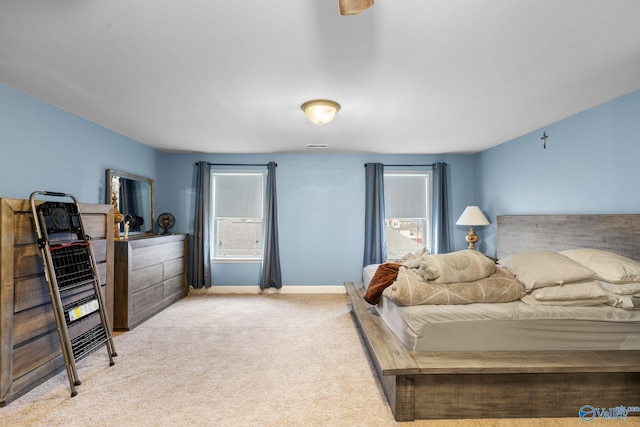 bedroom featuring carpet floors and baseboards