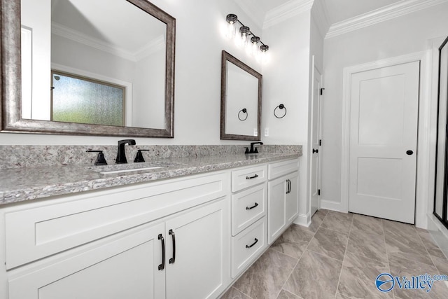 bathroom with ornamental molding and vanity