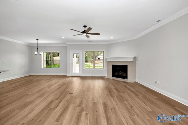 unfurnished living room with ornamental molding, ceiling fan, and light wood-type flooring