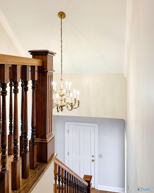 staircase featuring an inviting chandelier