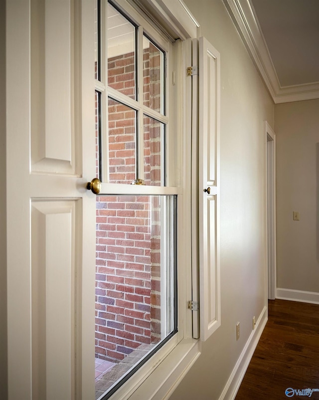 details with ornamental molding, wood finished floors, and baseboards