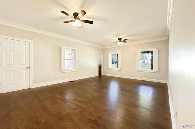 unfurnished room featuring ornamental molding, dark wood-style flooring, and a healthy amount of sunlight