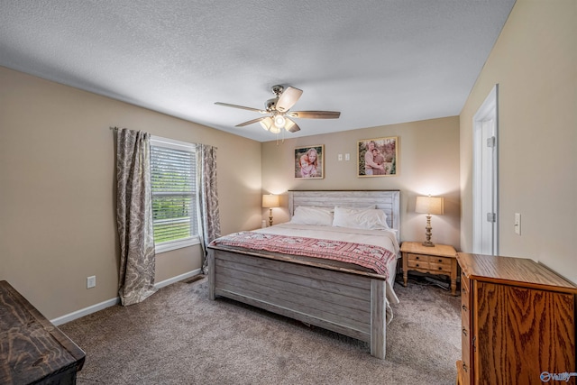 bedroom featuring a ceiling fan, carpet, and baseboards