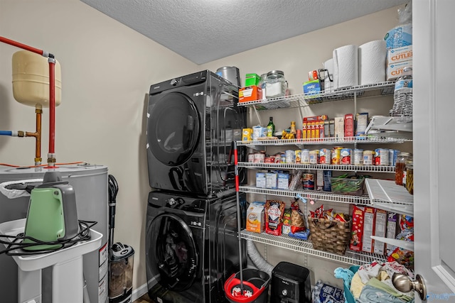 clothes washing area featuring stacked washer / drying machine, a textured ceiling, and laundry area