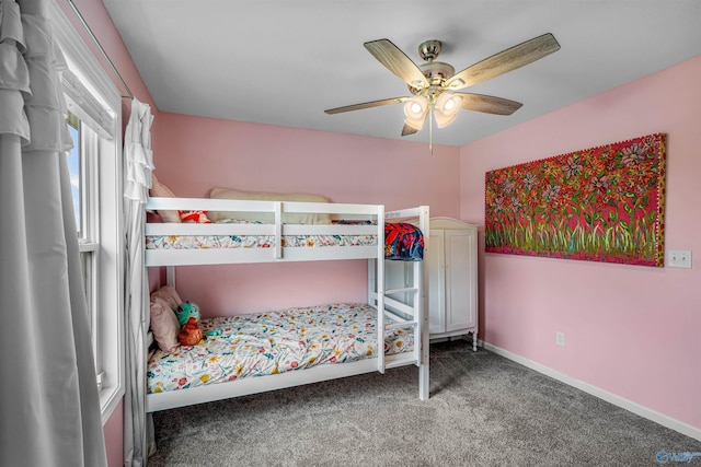 bedroom with carpet, a ceiling fan, and baseboards
