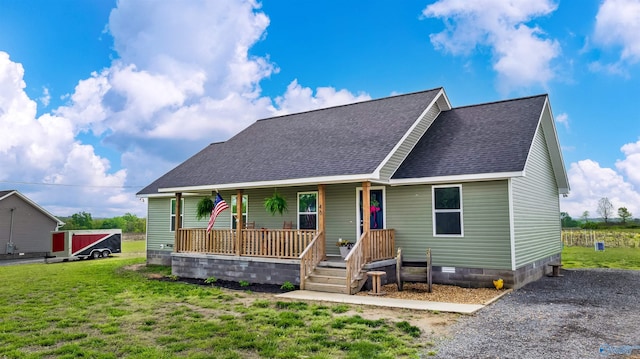 view of front of property with a porch, a front yard, and a shingled roof