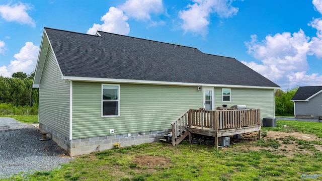 rear view of house with roof with shingles, a deck, central AC, and crawl space
