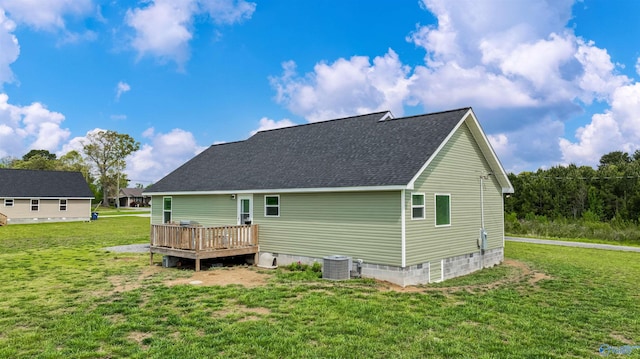 back of house with a wooden deck, crawl space, a yard, cooling unit, and roof with shingles