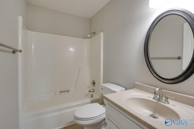 bathroom featuring toilet, shower / bathtub combination, and vanity