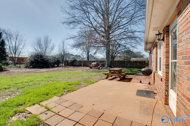 view of patio / terrace with a fenced backyard, area for grilling, and outdoor dining space