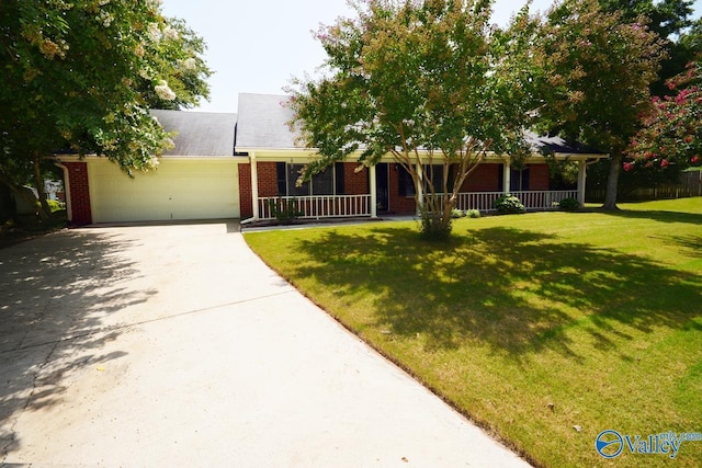 single story home with a garage and a front yard