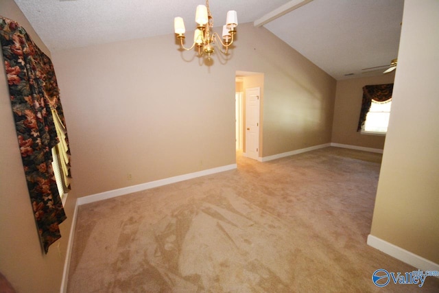 interior space featuring ceiling fan with notable chandelier and lofted ceiling with beams