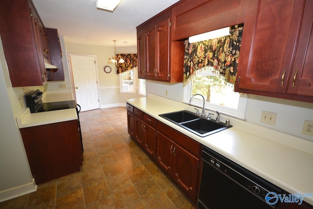 kitchen featuring pendant lighting, sink, dishwasher, range with electric stovetop, and a textured ceiling