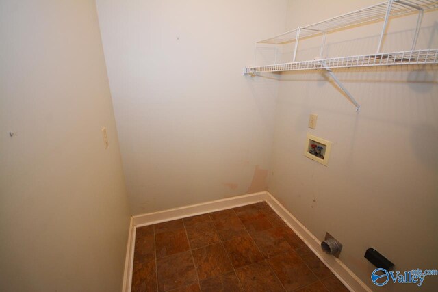 laundry area featuring tile patterned floors and washer hookup