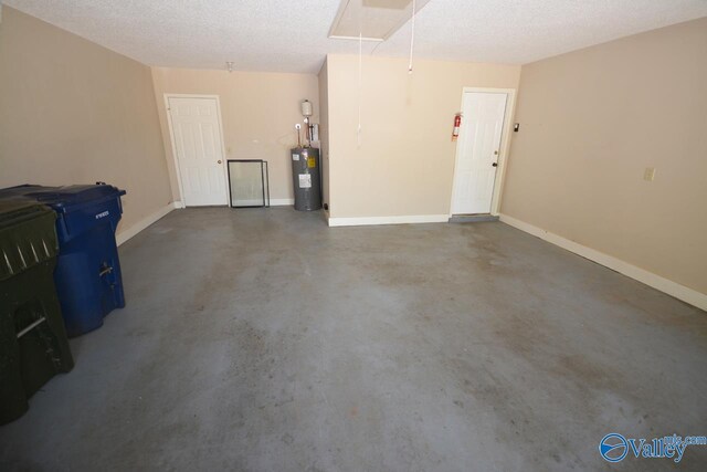 garage with electric water heater and fridge