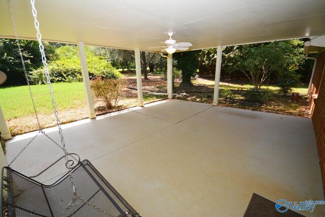 unfurnished sunroom with ceiling fan