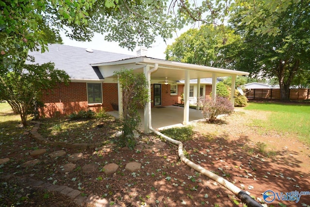 back of house with a patio