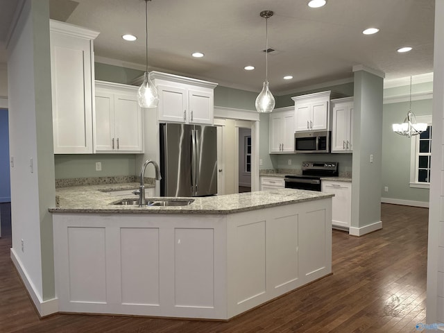 kitchen featuring a peninsula, white cabinetry, appliances with stainless steel finishes, and a sink