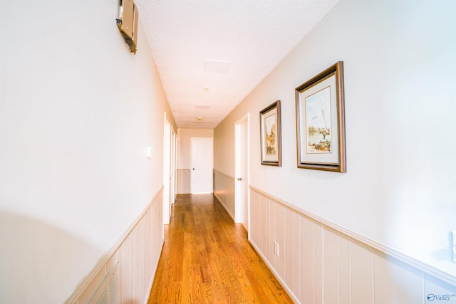 hallway with light wood-type flooring