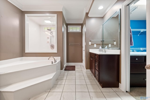 bathroom featuring tile patterned floors, a bathtub, vanity, and ornamental molding