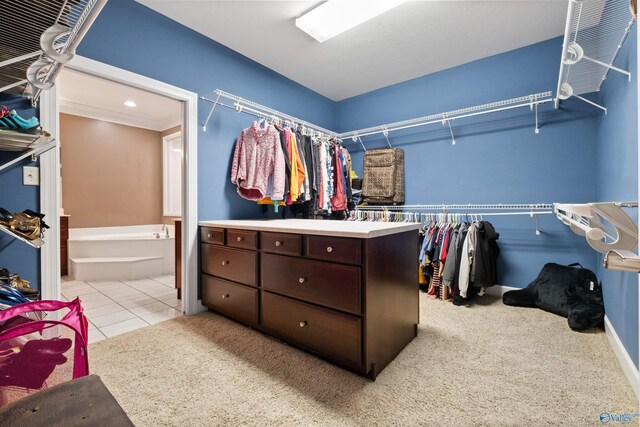 spacious closet featuring light tile patterned flooring