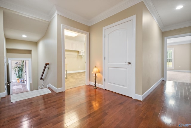 hall with crown molding and hardwood / wood-style floors