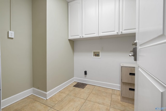 laundry area featuring washer hookup, cabinets, and light tile patterned floors