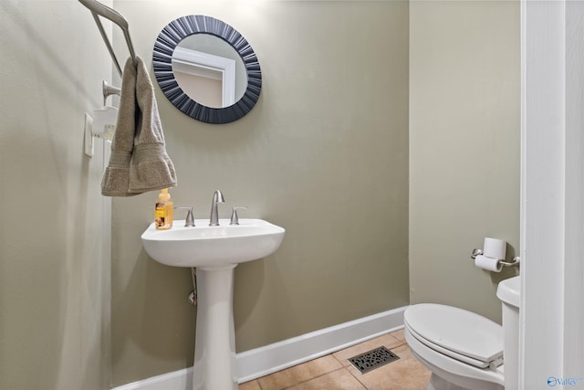 bathroom featuring tile patterned floors and toilet