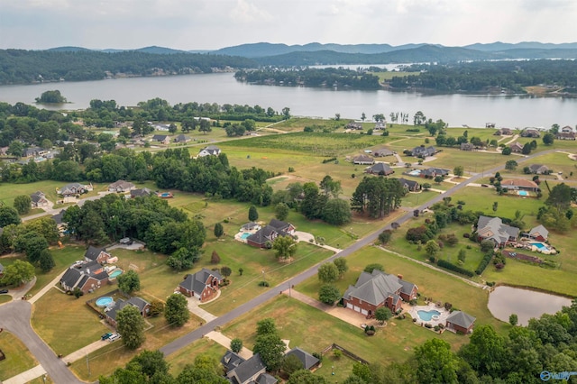 drone / aerial view with a water and mountain view