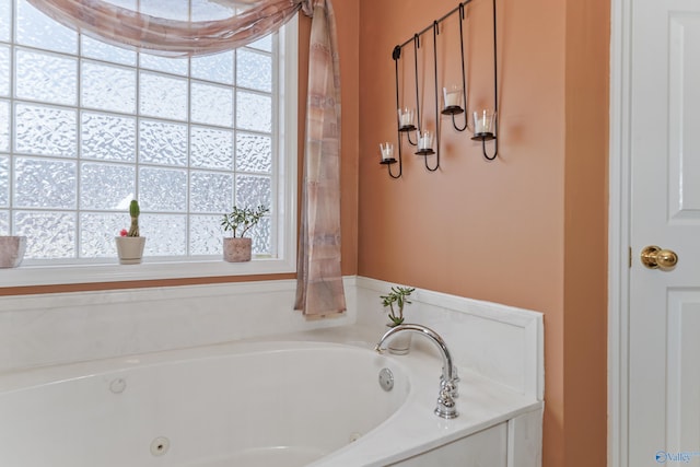 bathroom featuring a bathtub and a healthy amount of sunlight